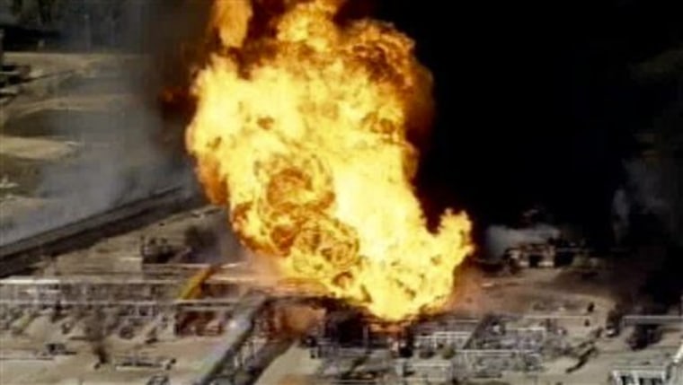 This frame grab from video made available by KPRC-TV, shows a fire burning at the Mont Belvieu petroleum plant east of Houston on Tuesday.